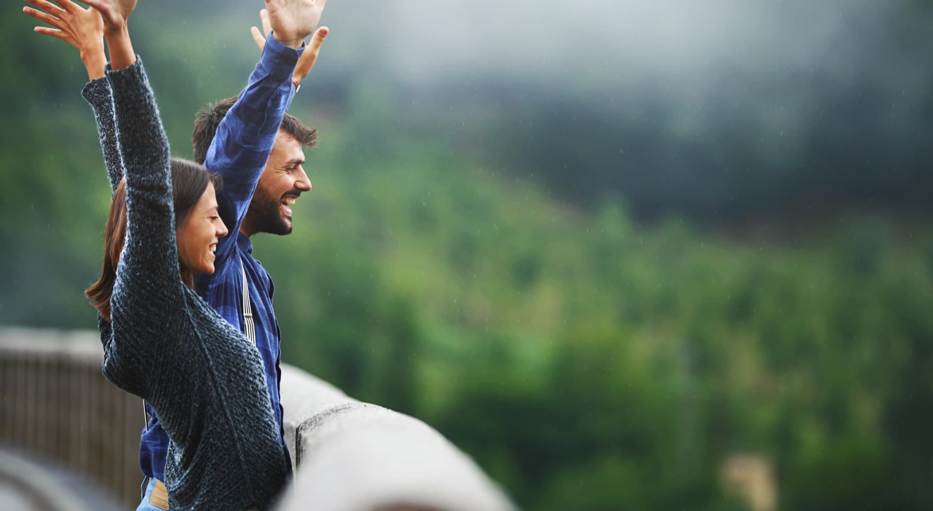 Couple enjoying mountain views from a scenic overlook in the High Country